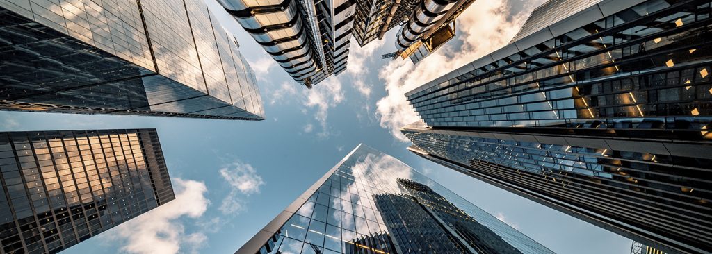Looking directly up at the skyline of the financial district in central London – stock image